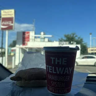 a cup of coffee and a sandwich