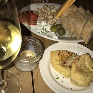 Happy hour plate with wine &amp; handpies