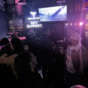 a group of people in a bar