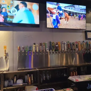 a row of beer taps in a bar