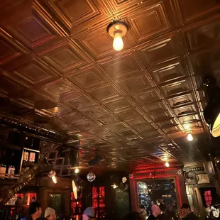 a group of people sitting at a bar