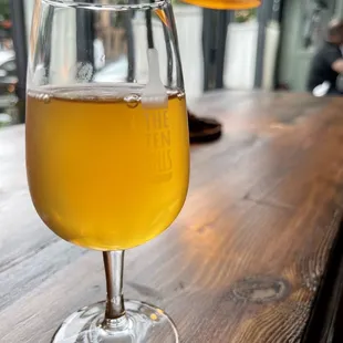 a glass of beer on a table