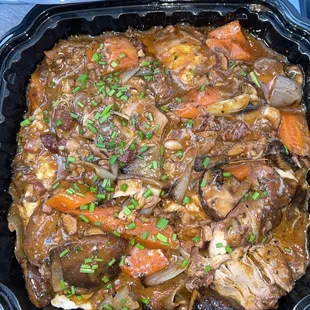Braised Chicken Thighs with mushrooms , shallots , carrots , applewood bacon &amp; a red win gravy with mashed potatoes