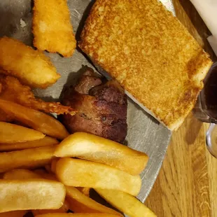 a plate of french fries and a grilled cheese sandwich