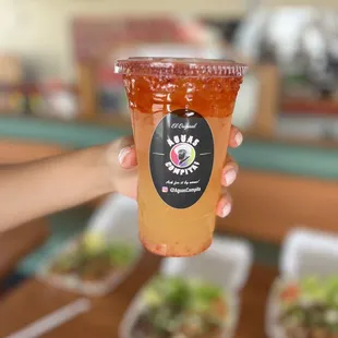 a person holding a drink