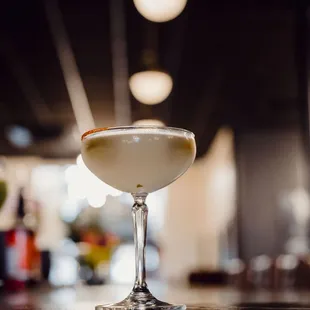 a cocktail in a coupe glass