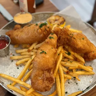 a plate of fried fish and fries