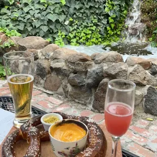 Pretzel with cheese and mustard dip