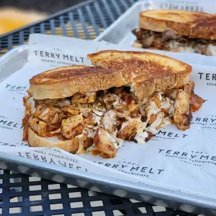 Chicken patty melt, steak in the back