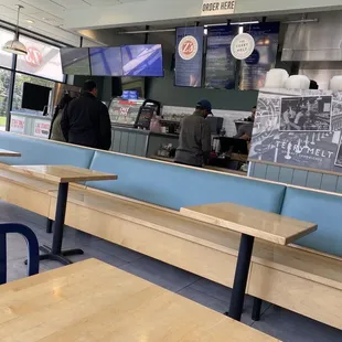 a restaurant with tables and benches