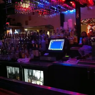 a bar with a laptop on the bar