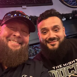 two men posing for a picture