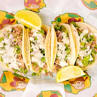 three tacos on a wrapper