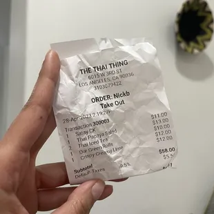a person holding a receipt