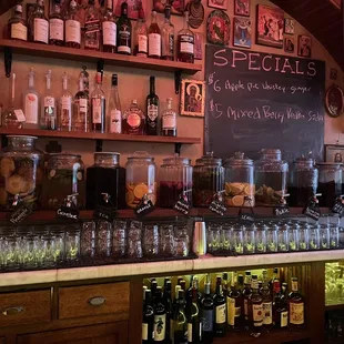 a variety of liquor bottles and glasses