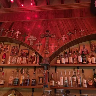 a shelf of liquor bottles