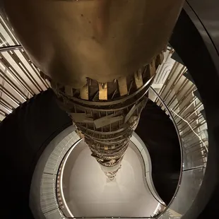 3rd Floor spiral staircase and beautiful three-story art piece.