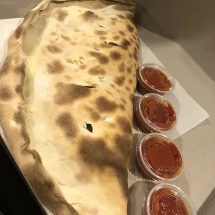 Medium white Stromboli with mild banana peppers, mushrooms and onions - asked for side red sauce for dipping .... yum!!