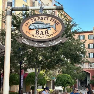 people sitting at tables outside