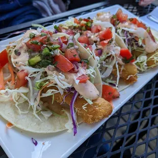 a plate of fish tacos