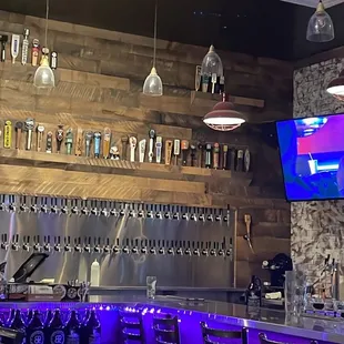 a bar with purple lighting