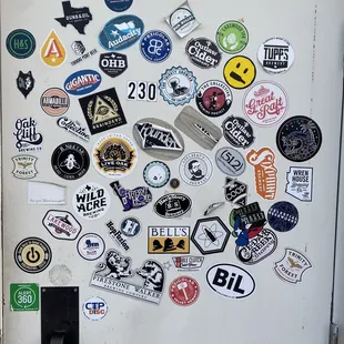 a fridge covered in stickers