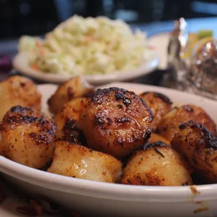 a plate of potatoes and coleslaw