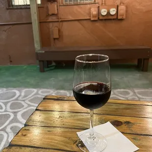 a glass of wine on a table