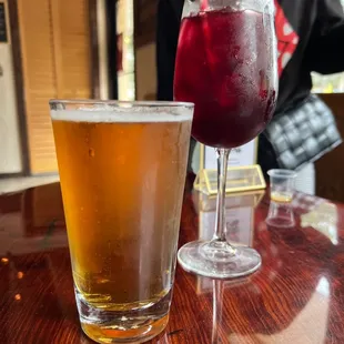a glass of wine and a glass of beer
