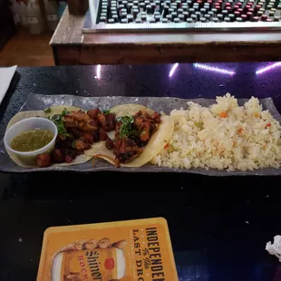a plate of food and a laptop