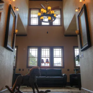 The second floor guest common area is outside the four guest rooms surrounding it.