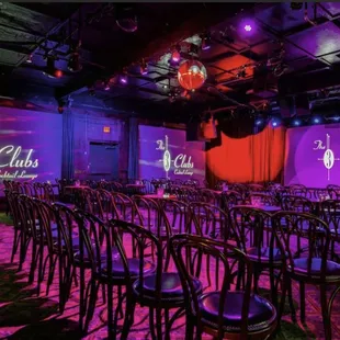 rows of chairs in front of a projection