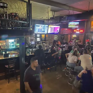 a crowd of people in a bar
