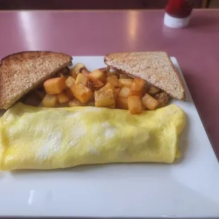 Ruben omelet with American fries and wheat toast. A very good choice for lunch today.