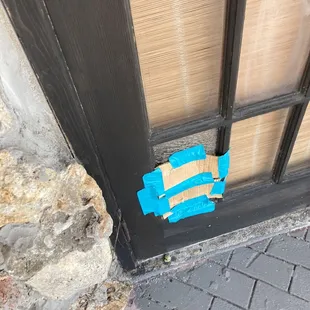 a piece of paper taped to a door