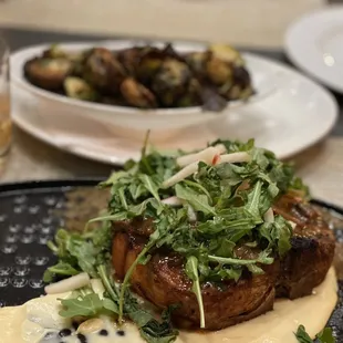 Grilled Porterhouse Pork Chop: wild mushroom sauce, parsnip puree, apple, arugula $32