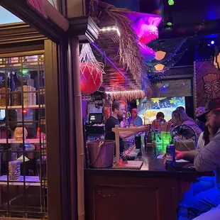 people sitting at a bar