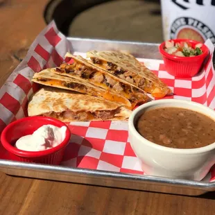 Quesadilla your choice of brisket, pulled pork, sausage or chicken. Served with a side of your choice.