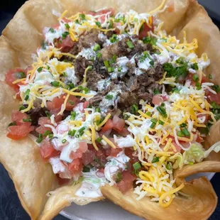 Fried taco shell stuffed with your choice of smoked brisket, pulled pork or chicken. Topped with lettuce, cheese &amp; pico de gallo.