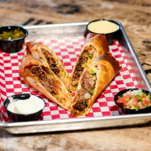 Our Flautas are crispy flour tortilla wrapped with your choice brisket, sausage, pulled pork or chicken. Topped with Cheese &amp; Pico de Gallo.