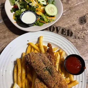 Fried white fish battered in corn meal &amp; seasoning. Served over crispy fries &amp; fresh side salad.