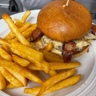 Texas Bacon Burger drizzled with Queso &amp; topped with fresh jalapeño.