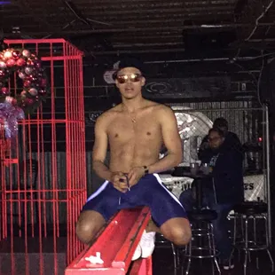 a man sitting on a red bench