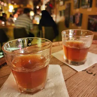 two glasses of tea on a table