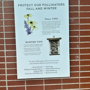 a sign on a brick wall