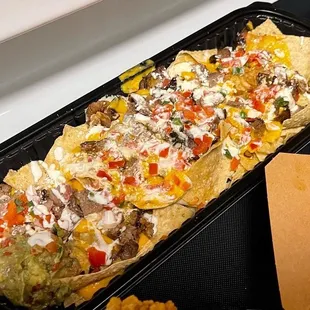 a tray of nachos and chips