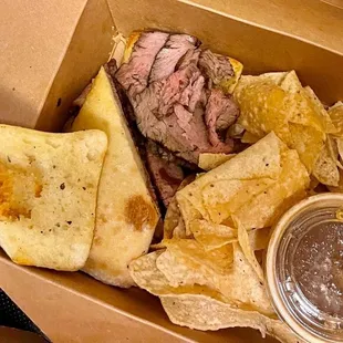 a box of chips and a sandwich