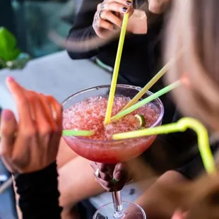 a woman holding a drink