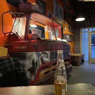 an old truck and a beer