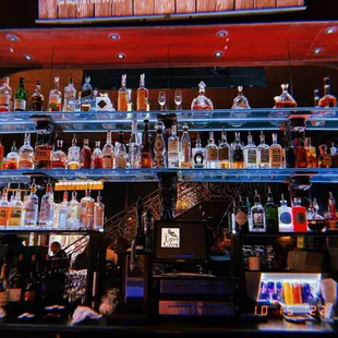 a shelf of liquor bottles